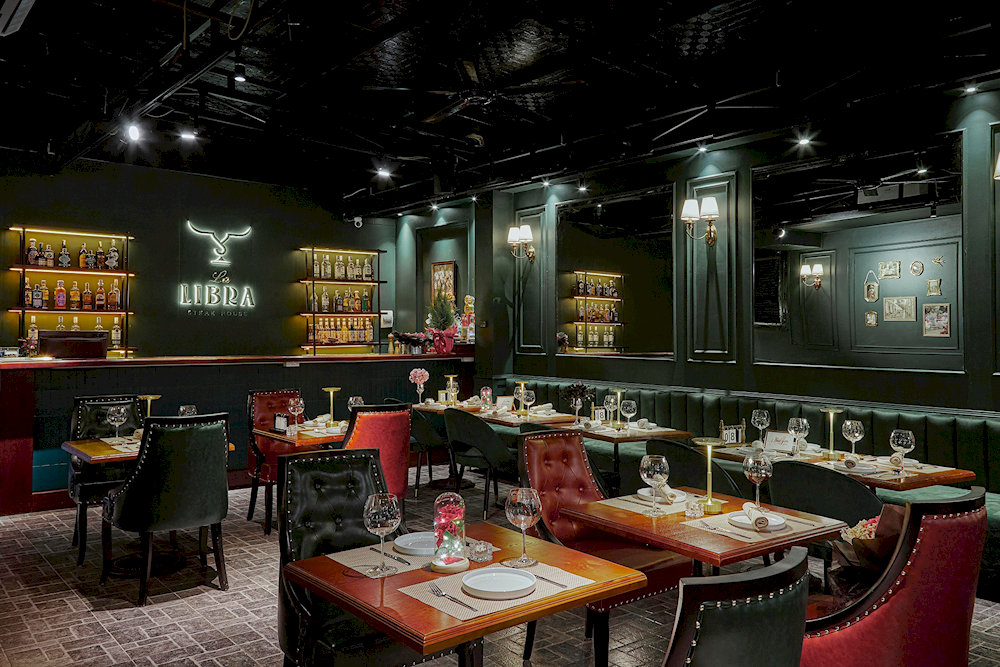 The restaurant boasts an opulent classic European interior with ornate details and timeless elegance 