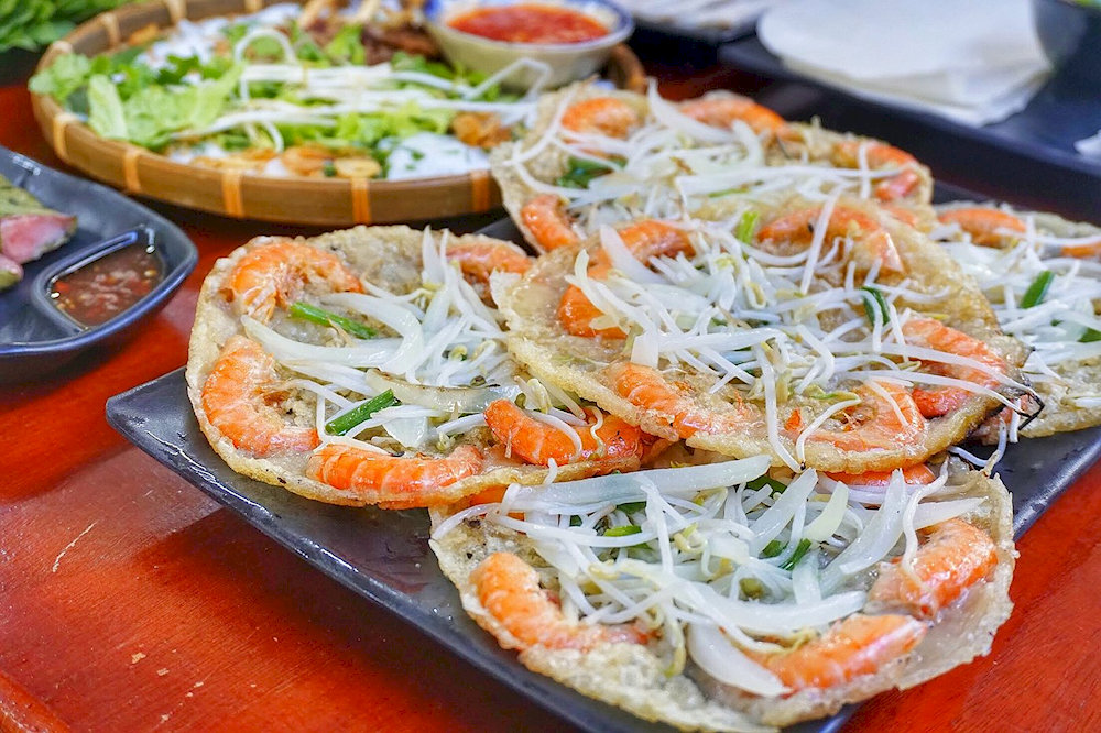 Crispy “banh xeo tom nhay” is made from fresh shrimp and rice flour, fried to golden perfection 