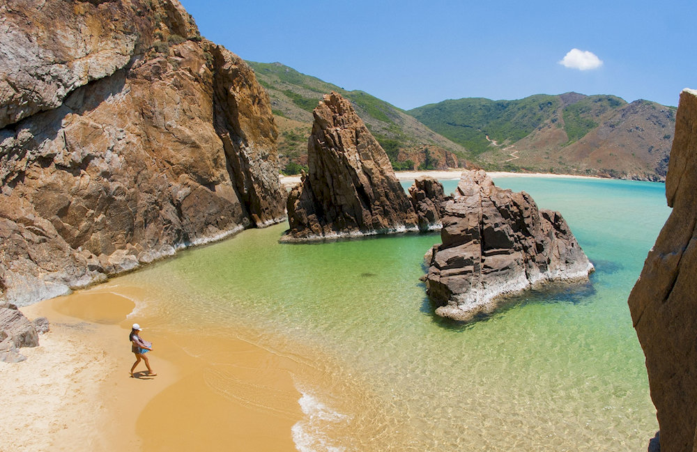 The remarkable rock formations that emerge from the sea add to the natural beauty of Ky Co Beach