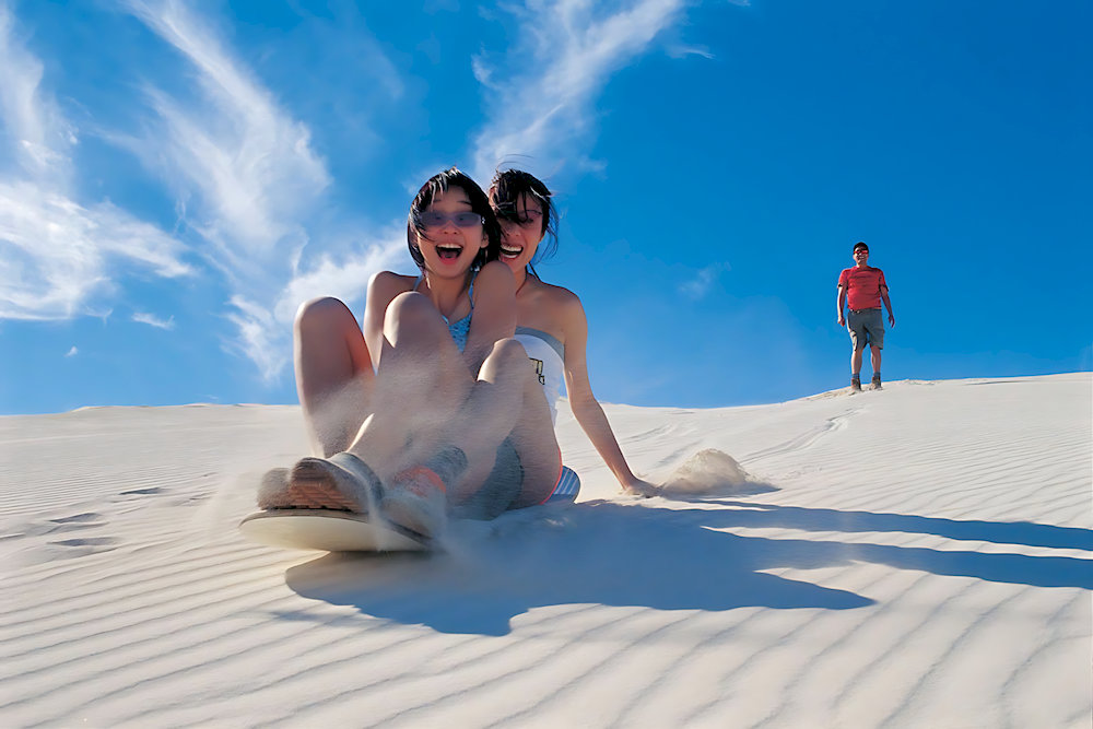 Sand sliding at Phuong Mai Sand Dunes is an interesting and unforgettable experience